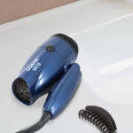 Conair 2 Speed Dual voltage 1875 Watt Compact Folding Ionic Hair Dryer in Dark Blue